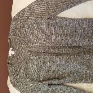 Sweater with hooks closure. Silver/metal color.  Like new, been worn only ones